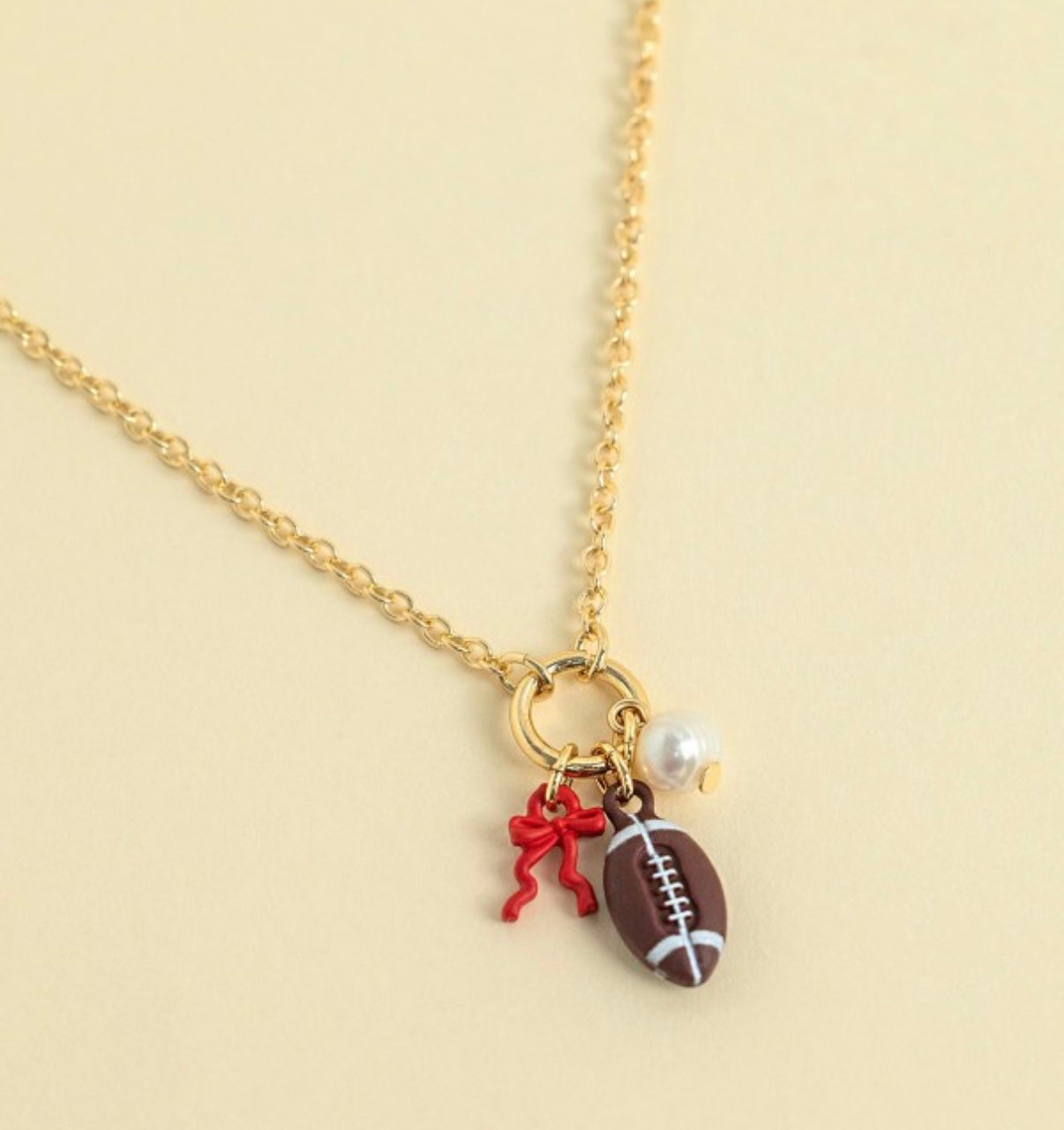 Football bow charm necklace